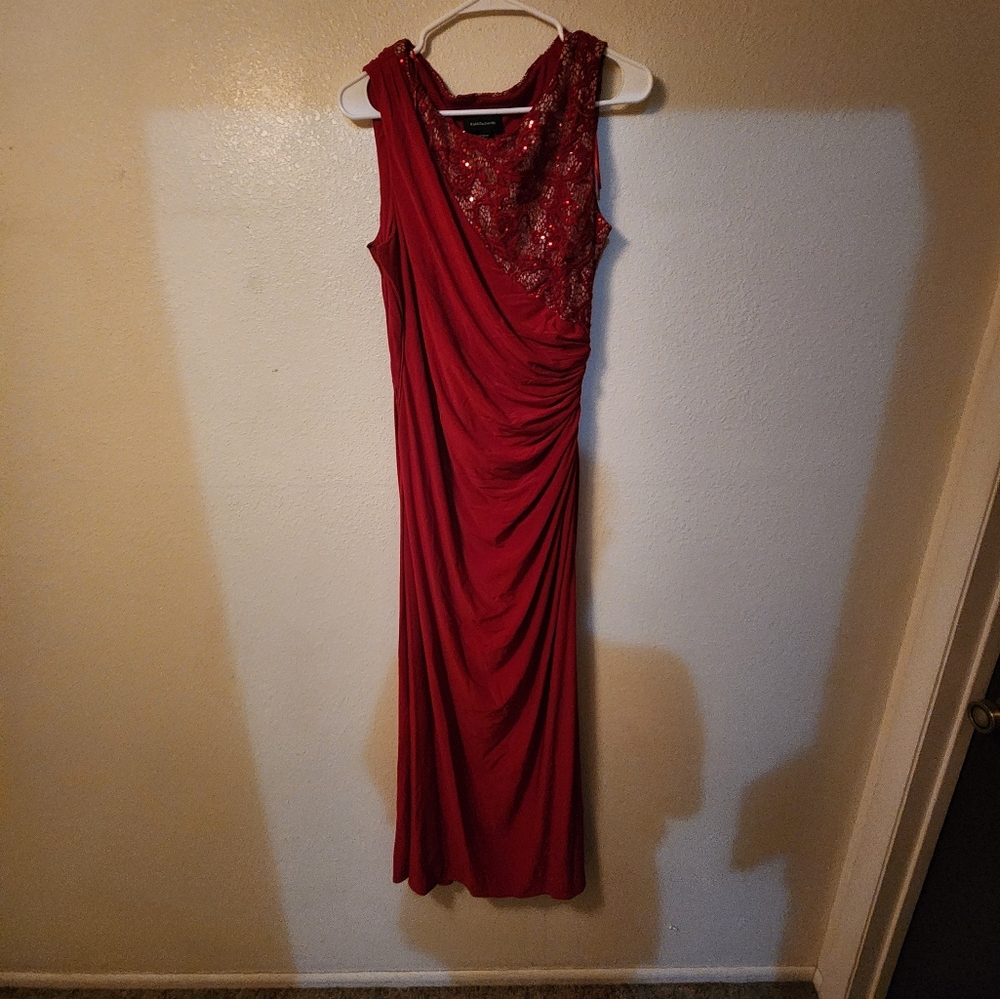 Red floor length slit prom dress.